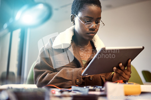 Image of Student, education and black woman with tablet for learning, knowledge research or studying at home. Technology, digital touchscreen and female internet browsing, social media or networking at night.