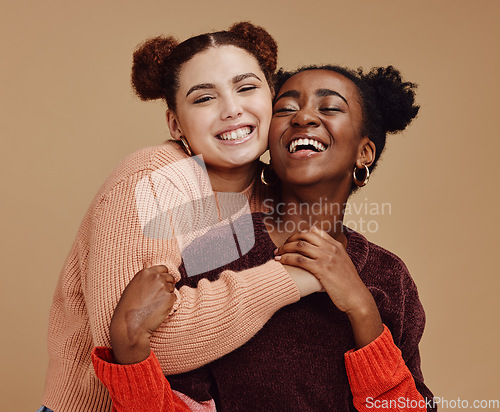Image of Lesbian, couple hug with young women and happy with fashion and marketing, love and fun together against studio background. Lgbtq community, gen z and freedom with style and lgbt people with pride