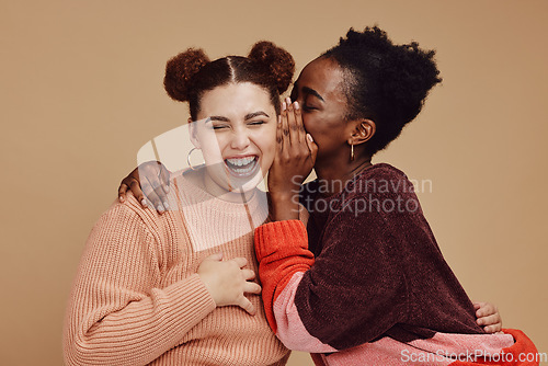 Image of Friends, gossip and women laughing at secret joke on studio background with smile on face. Secrets, rumor and whisper in ear, black woman with happy woman discuss funny announcement for advertisement