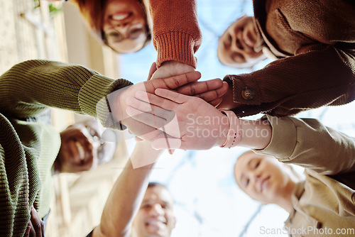 Image of Below, hands stack and group of students for motivation, support or education in summer sunshine. Diversity, hand together and learning with teamwork, studying or scholarship at university for future