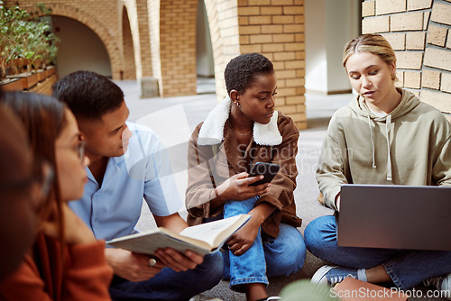 Image of University, education and student group studying with laptop, book and phone with collaboration and discussion. Learning, scholarship and college students together talking with teamwork on campus