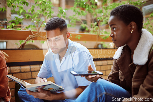 Image of Reading man, black woman or books phone research on university, school or college campus in group study. Students, people or friends on mobile technology in learning, education or scholarship goals