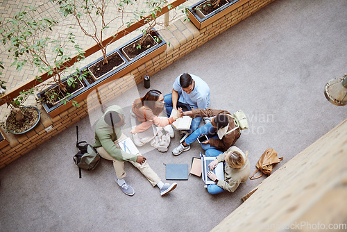 Image of University group collaboration, high five and students happy for research, college project or education study teamwork. Learning, team building or top view of excited diversity people on school floor