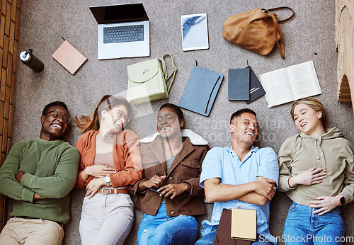 Image of College floor, diversity and laughing students relax after group project, research education study or university teamwork. Knowledge, learning and top view of happy friends on school campus ground