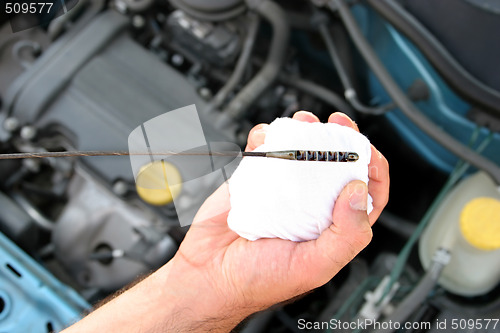 Image of checking engine oil dipstick