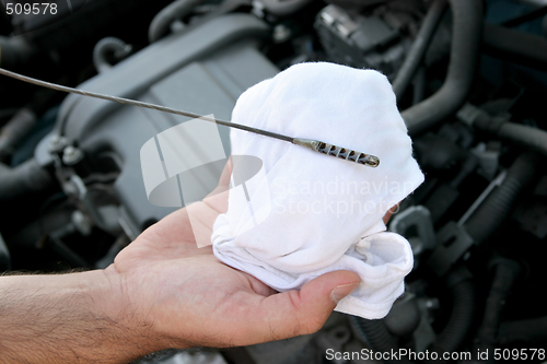 Image of checking engine oil dipstick