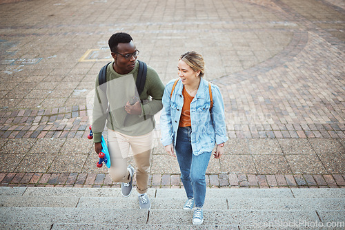 Image of University, students talking and friends, education and campus, study discussion with walk and talk together with learning. Scholarship, college and communication with black man and woman on steps