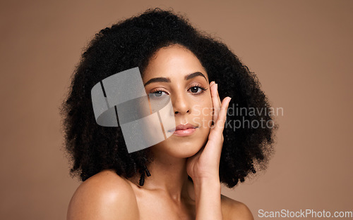 Image of Face, beauty and hair care with black woman and hair, skincare portrait with microblading, healthy skin and glow mockup. Natural curly hair, hand and cosmetic care, facial against studio background