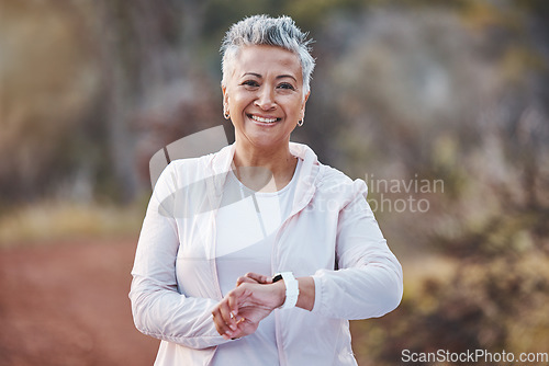 Image of Fitness, smartwatch and portrait of a senior woman in nature for running, cardio and workout for health and wellness. Elderly female in a forest with watch app for healthy lifestyle, body and energy