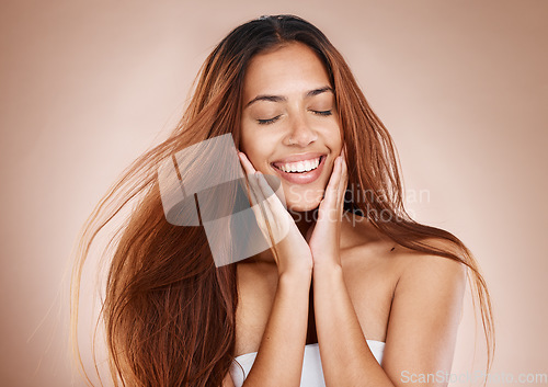 Image of Beauty, hair care and face of woman with eyes closed in studio on brown background. Skincare, makeup cosmetics or female model satisfied with salon treatment for balayage hairstyle, growth or texture