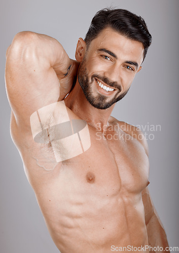 Image of Portrait, beauty and body with a man bodybuilder in studio on a gray background for health or fitness. Face, training and exercise with a handsome model male posing to promote a healthy lifestyle