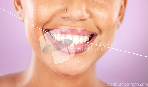 Image of Teeth, dental floss and beauty with woman, face zoom and smile, cosmetic and oral healthcare against purple background. Flossing, fresh breath and health for mouth, teeth whitening with Invisalign.