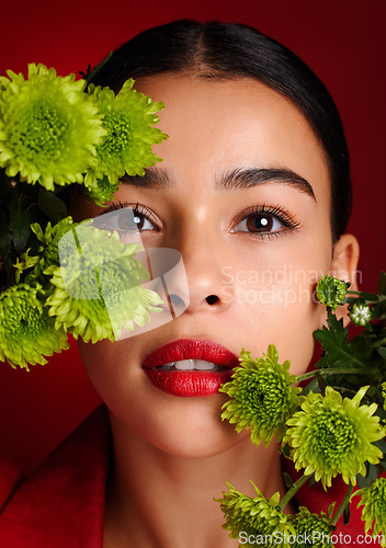 Image of Beauty, flowers and face with woman and lipstick, natural cosmetics with nature, skincare and organic treatment against red studio background. Lips, portrait and microblading, eyebrow care and makeup