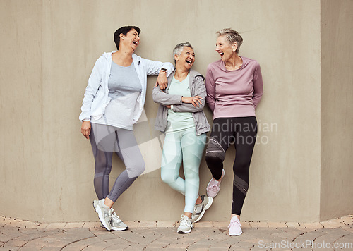 Image of Senior women, exercise and funny with retirement, fitness and wellness, vitality and active lifestyle against wall background. Mature female friends, comedy and training, relax and sports motivation