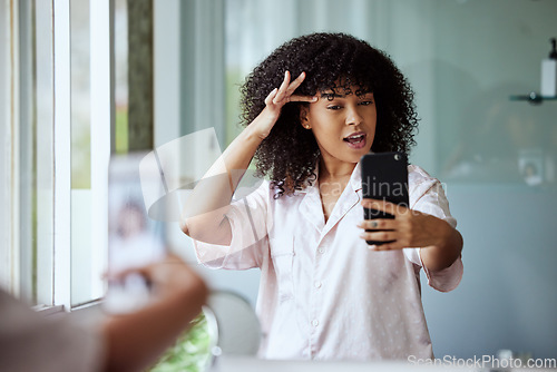 Image of Bathroom selfie, beauty influencer and black woman doing skincare, house facial and social media. Wellness, morning self care and mobile with a woman online with cosmetics and natural skin glow