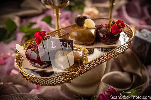 Image of Still life of heart shaped mini cakes