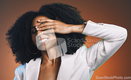 Image of Black woman, hand with manicure and face with beauty, hair care and happy with afro against studio background. Makeup cosmetic, nails and skincare with facial and natural curly hair texture