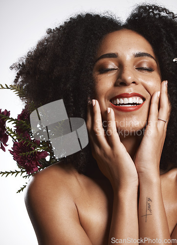 Image of Peace, skincare and makeup girl with flowers satisfied with beauty and glowing texture routine. Aesthetic, health and wellness of confident black woman with beautiful smile in white studio.