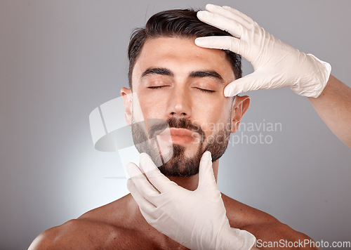 Image of Plastic surgery, cosmetics and man with doctor hands in studio mockup for botox, aesthetic or facial dermatology for medical or beauty. Mesotherapy, hyaluronic acid or collagen of young model face