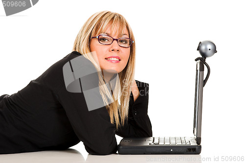 Image of A businesswoman using laptop and webcam