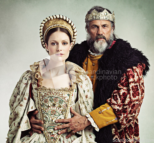 Image of Crown, queen and king in costume isolated on studio background for medieval, renaissance and England culture. Headshot portrait of royal couple with power, wealth and vintage fashion for power