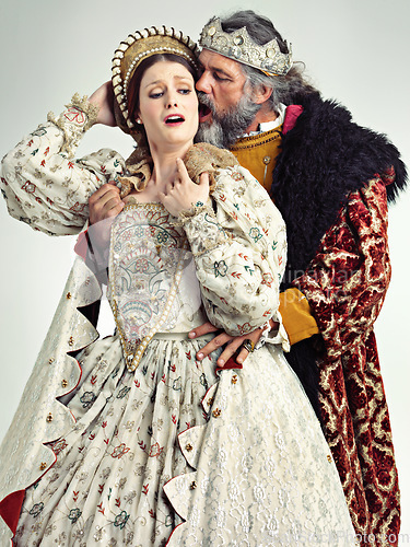Image of Medieval king, queen and violence in studio for drama, danger and together with renaissance clothes. Ancient royal couple, surprise and shock with distress, crying and actor with vintage fashion