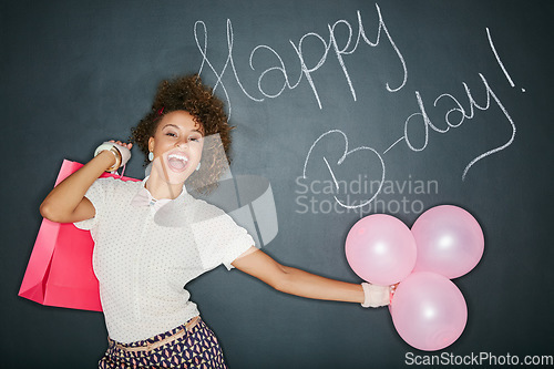 Image of Smile, birthday balloons and portrait of a black woman with a gift and chalkboard for celebration. Happy, smile and excited person with a present and party sign with a model and happy birthday