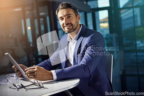 Image of Portrait, tablet and research with a business man on a mission in his office at work for success. Corporate, internet and search with a male employee, manager or boss working on his company vision