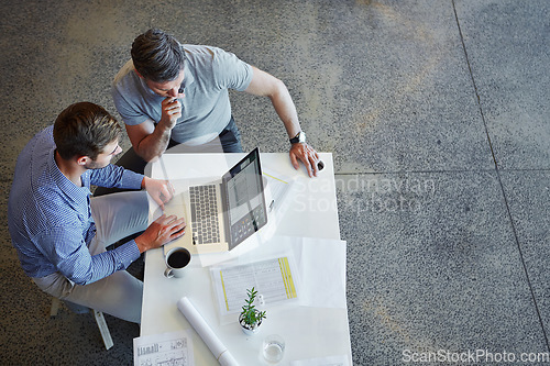 Image of Top view, teamwork and business people with laptop in office. Planning, strategy and collaboration of male employees with computer working on sales, advertising or marketing project in workplace.