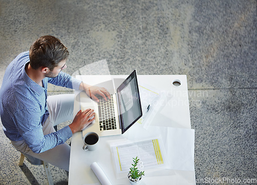 Image of Top view, business and man with laptop, typing and planning for schedule, project deadline and office. Male employee, ceo and entrepreneur with digital marketing, online research and web launch