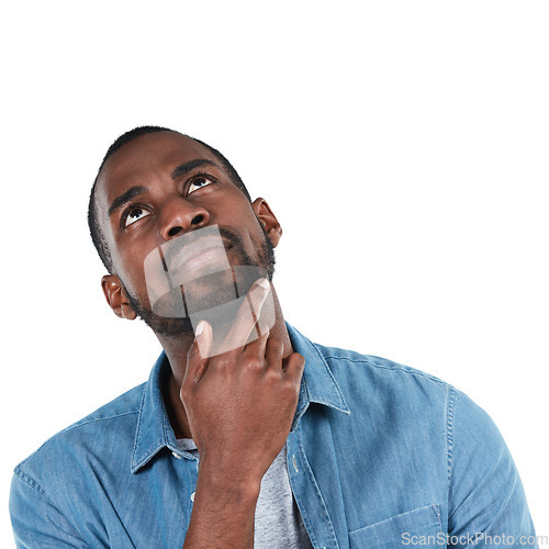 Image of Black man, thinking and studio for idea, vision or inspiration with denim fashion by white background. Young african man, ideas or isolated for focus, brainstorming or think on future, life or career