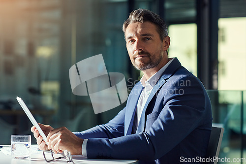 Image of Portrait, CEO or businessman with a tablet working overtime in an office at night and looking confident. Executive financial manager, entrepreneur or digital marketing professional with a vision