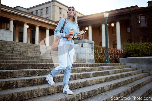 Image of Woman, student on campus stairs and university, education with learning and academic goals with scholarship outdoor. Books for reading, study and happy person with success, college life and studying