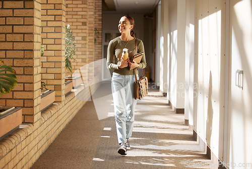 Image of Woman, student and university hallway with a person walking ready for learning and study. Smile, college and back to school happiness of a female tutor on campus going to class happy and alone