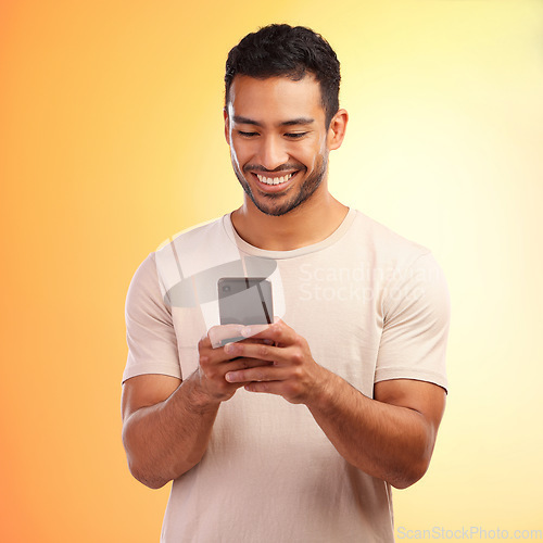 Image of Man, studio and phone for social media, chat and online dating with smile, reading and happiness. Model, smartphone communication and texting app on social network ui and digital contact on internet
