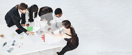 Image of Meeting, finance and collaboration with a business team working around a table in the boardroom from above. Accounting, documents and teamwork with a man and woman employee group at work in an office