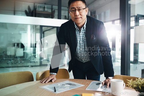 Image of Professional, corporate and portrait of a mature businessman working on data in an office. Start, success and Asian employee with paperwork, documents and finance notes for accounting at an agency