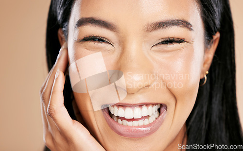 Image of Happy, makeup and portrait of a woman with a smile for skincare isolated on a studio background. Laughing, happiness and face of a cosmetics Asian model smiling for glow on skin on a backdrop