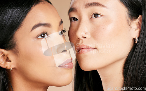 Image of Face, beauty and diversity with model woman friends closeup in studio on a beige background. Skincare, facial or cosmetics with an attractive young female and friend posing to promote a skin product
