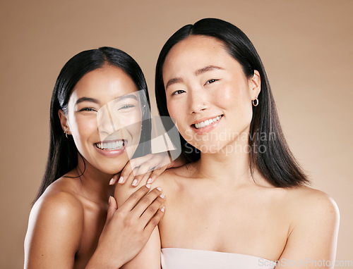 Image of Portrait, beauty and diversity with model woman friends in studio on a beige background for skincare. Face, skin and wellness with a young female and friend posing to promote a cosmetic product