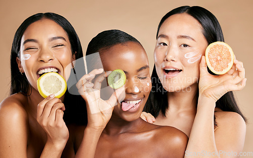 Image of Face, fruit and women in portrait with cream for facial care, beauty and natural cosmetics isolated on studio background. Sunscreen, vegan and different skin with skincare, moisturizer and playful