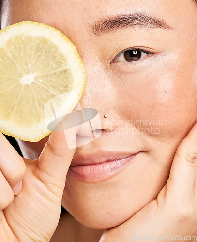 Image of Skincare, beauty and portrait of an Asian woman with a lemon for body detox, health and wellness. Vitamin c, food and happy Japanese model with a fruit for diet, nutrition and vegan dermatology