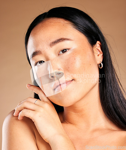 Image of Asian woman, face and portrait smile for skincare, cosmetics or beauty against brown studio background. Happy Japanese female, person or lady model smiling in satisfaction for facial or perfect skin