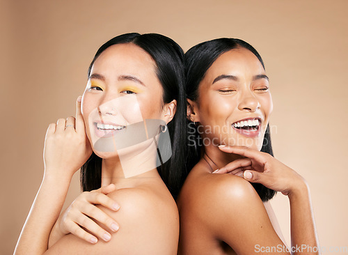 Image of Women, beauty and makeup in studio for wellness, hygiene and creative grooming on brown background. Face, friends and eyeshadow by girl with different, skin and luxury skincare, relax and isolated