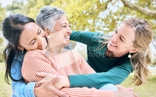 Image of Retirement hug, seniors and bonding women in nature park, grass garden or relax environment in trust, community or security. Smile, happy and elderly friends in embrace for support or birthday pride