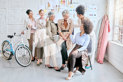 Image of Fashion, designer and teamwork of women laughing at funny joke, comedy or crazy meme in workshop. Group collaboration, small business or comic senior female tailors together in boutique in discussion