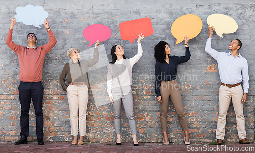 Image of Speech bubble, communication and feedback with business people and mockup for social media, vote and review. Design, contact and chat sign with employee and board at brick wall for voice and opinion