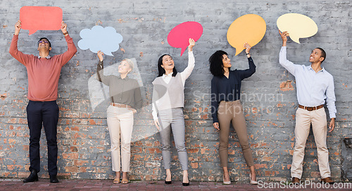 Image of Speech bubble, feedback and question with business people and mockup for social media, vote and review. Design, contact and chat sign with employee and board at brick wall for voice, opinion and idea