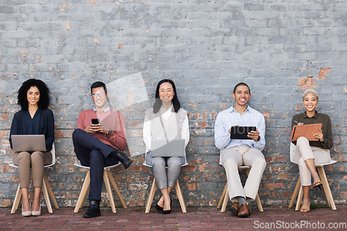 Image of Diversity, Interview and relax business people line with technology for meeting, recruitment or company hiring. Human resources, employees happy and working on laptop, tablet or smartphone in studio