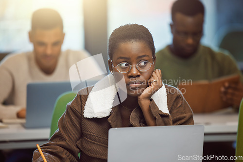 Image of Student stress, anxiety or fear in exam, test or classroom lesson on laptop in university, school or college campus. Black woman, crsis or problem on technology studying or education learning burnout